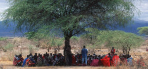 Picture of people under a tree in Tanzania