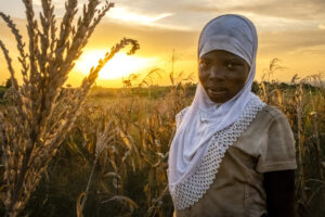 Woman standing in a field of grain
